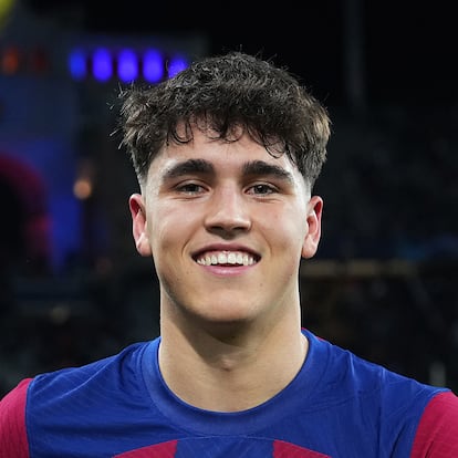 BARCELONA, SPAIN - MARCH 12: Pau Cubarsi of FC Barcelona poses for a photo after being awarded as the PlayStation Player of the Match at full-time following the team's victory in the UEFA Champions League 2023/24 round of 16 second leg match between FC Barcelona and SSC Napoli at Estadi Olimpic Lluis Companys on March 12, 2024 in Barcelona, Spain. (Photo by Angel Martinez - UEFA/UEFA via Getty Images)